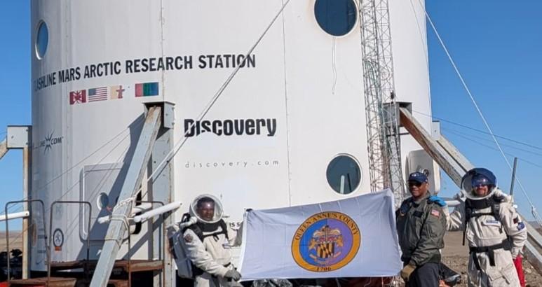 Team with Queen Anne's County flag at Mars research station